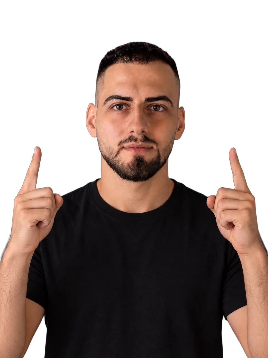 The owner of the group looking into the camera and pointing up with both index fingers